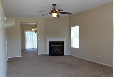 Large living room with half bath and gas log firep