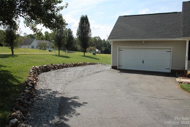 Extended Driveway with Rock Wall for Additional Parking