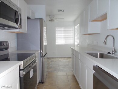Kitchen with appliances with stainless steel finis