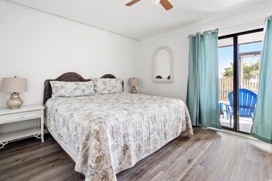 Bedroom with access to outside, dark hardwood / wo