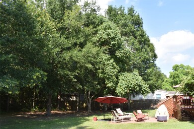 Wonderful trees in back yard with Patio and Deck to enjoy it.