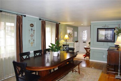 Spacious formal dining room features wainscoting, 