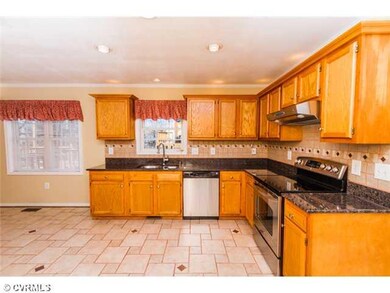 Kitchen - Gorgeous tile floors and stately granite countertops