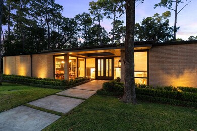 Another view of the extraordinary home in a sought after location. Landscaping lighting at the trees and the flower beds illuminate this home during the evening. Walking distance to the sought after elementary school. Expansive front green space. Sprinklers and gutters installed.