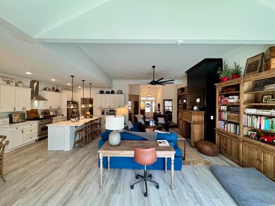 Interior space featuring lofted ceiling, ceiling f
