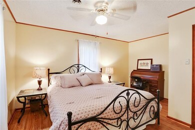 Master Bedroom - light colors, ceiling fan, vinyl 