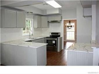 View of kitchen with new flooring, cabinets, and m