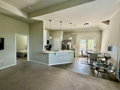 Kitchen featuring freestanding refrigerator, a br