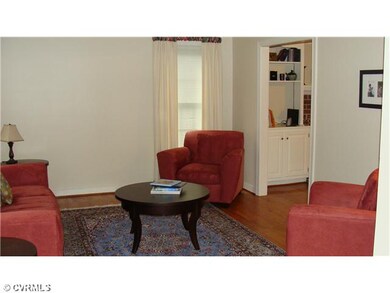 Living Room - The living room has wood floors and 