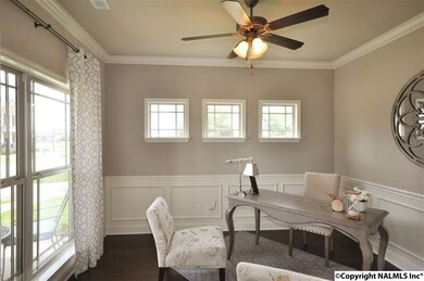 This beautiful space boasts lots of natural light, wainscoting, and hard wood floors.  They perfect study for peace and productivity.