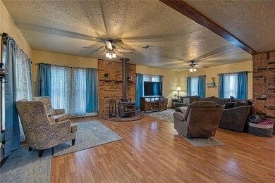 Living room featuring wood burning stove.