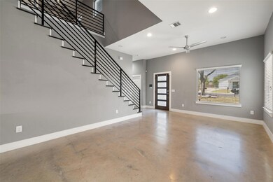 Foyer entrance with finished concrete flooring, s