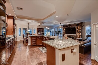 Kitchen featuring open floor plan, wood-type floor