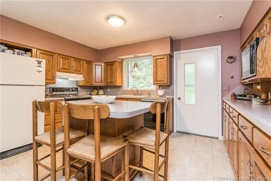 The kitchens boasts an island and plenty of counte