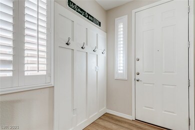 Features custom woodwork, and coat hooks.