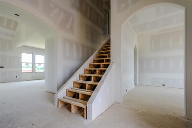 Dramatic 2-story foyer welcomes you to this home.