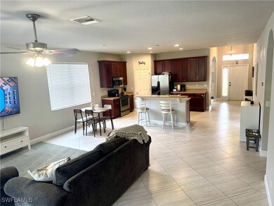 Tiled living room with ceiling fan
