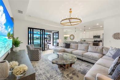 Living room with a notable chandelier and a tray c