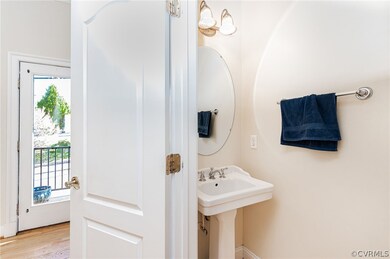half bath adjacent to living area and kitchen