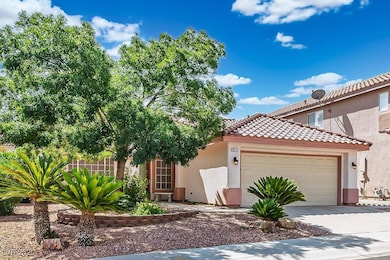 Mediterranean / spanish-style house featuring stucco siding, a garage, concrete driveway, and a tile roof