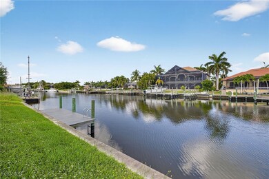 Dock featuring a water view and a lawn