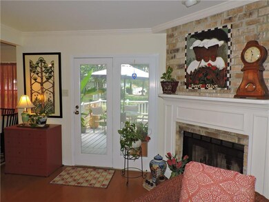 Living Room. Door opens onto patio deck. Wood floo
