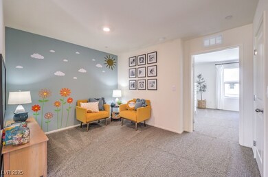Living area with carpet and baseboards