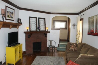 Living room with hardwood floors and natural woodwork!