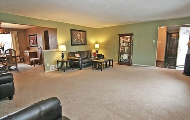 The living room is open to the dining room for an 