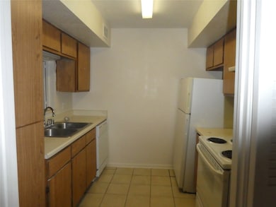Kitchen with electric cooktop.