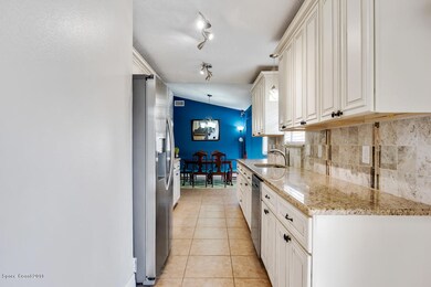 Kitchen towards dining from Laundry room