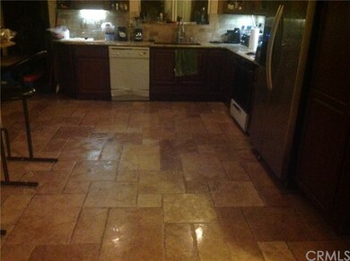 Kitchen area, travertine floors, granite counters,