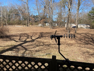 A view from the front porch of this good size front yard.
