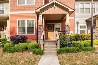 Doorway to property with stone siding