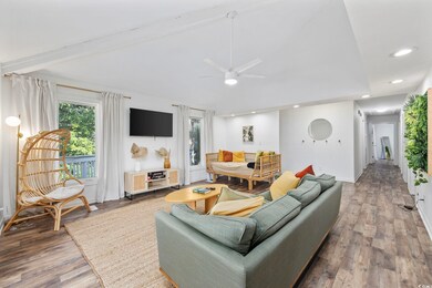 Living room with hardwood / wood-style floors, vau