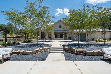 Rear view of house featuring fence