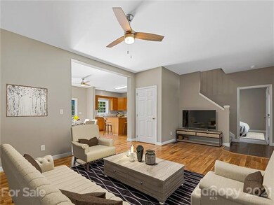 Living Room into Dining, and Kitchen