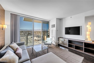 Living area featuring expansive windows, visible v