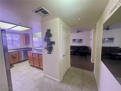 Kitchen featuring dishwasher, a textured ceiling,
