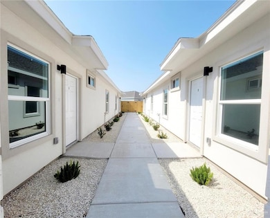 View of patio featuring fence