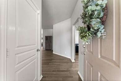 Secondary bedrooms to the right, garage access to