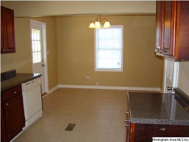 2nd view of kitchen showing eating area.