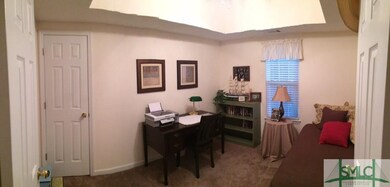 The Third Bedroom, located behind double doors in 