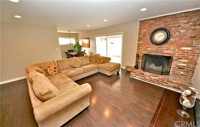 Newer laminate wood flooring and floor-to-ceiling 
