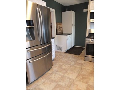 Kitchen comes with stainless steel appliances.