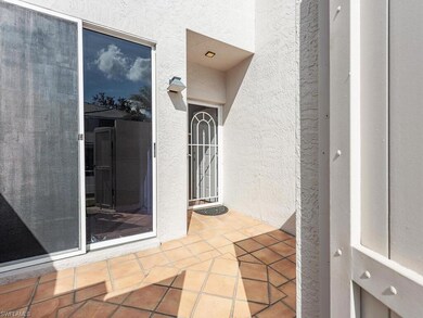 Doorway to property with a patio area