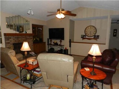 THE SPACIOUS LIVING ROOM HAS A FIREPLACE!