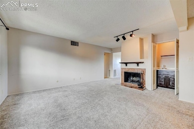 Unfurnished living room featuring carpet floors, a