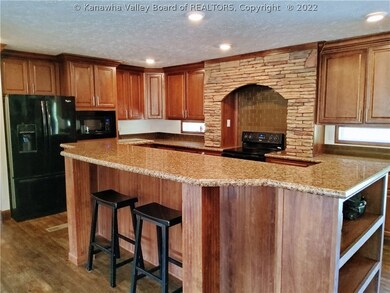 CUSTOM CABINETRY AND STONE COOKING AREA