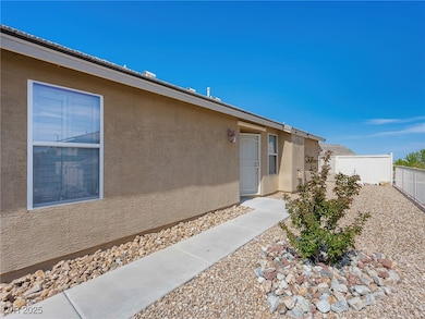 Property entrance featuring stucco siding